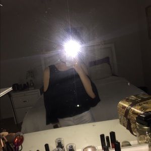 A black bell sleeve top